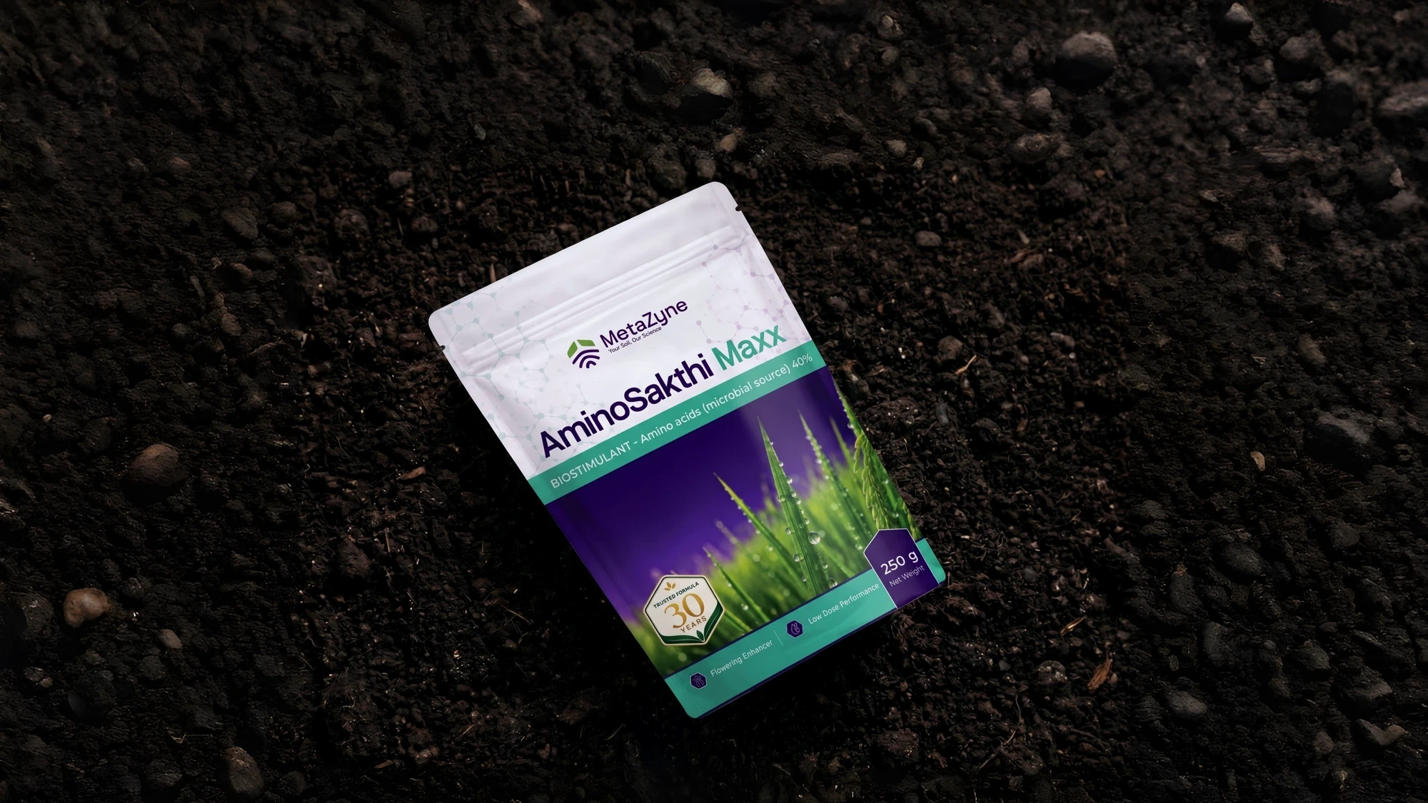 AminoSakthi Maxx pouch lying on dark soil