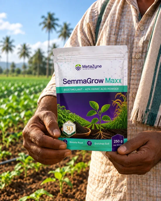 Farmer holding a SemmaGrow Maxx pouch in front of a coconut-palm-lined field