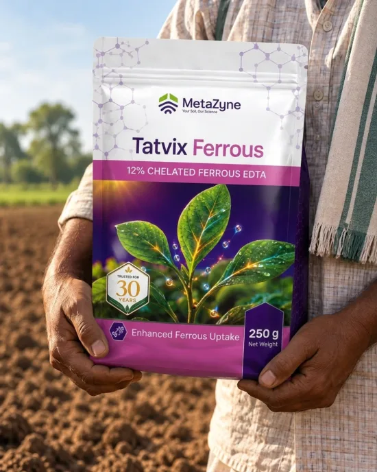 Farmer holding a Tatvix Ferrous pack in a tilled field