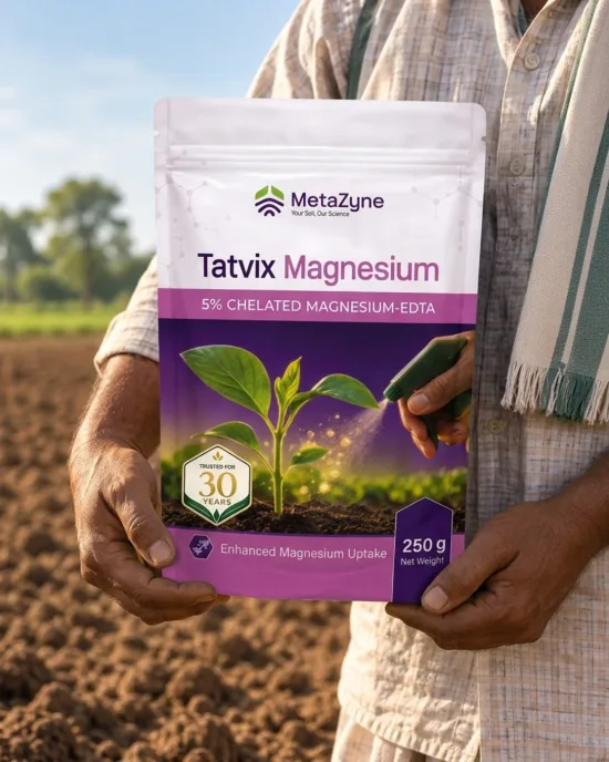 Farmer holding a Tatvix Magnesium pack in a tilled field