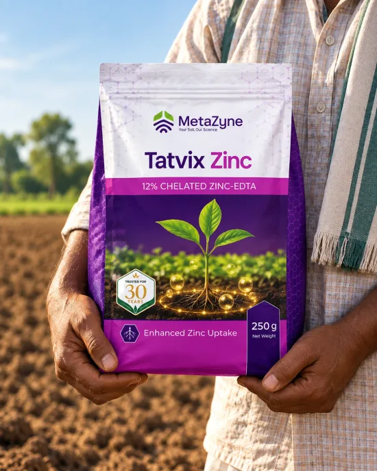 Farmer holding a Tatvix Zinc pack in a tilled field